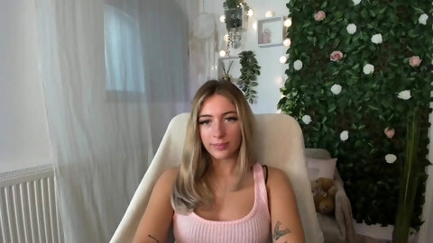 Petite blonde with big tits and ass teases on webcam