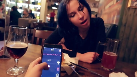 I took control of my stepsister's vibrator in the bar and brought her to orgasm.